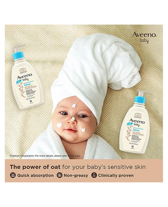 Baby with Aveeno baby lotion bottles on a beige background