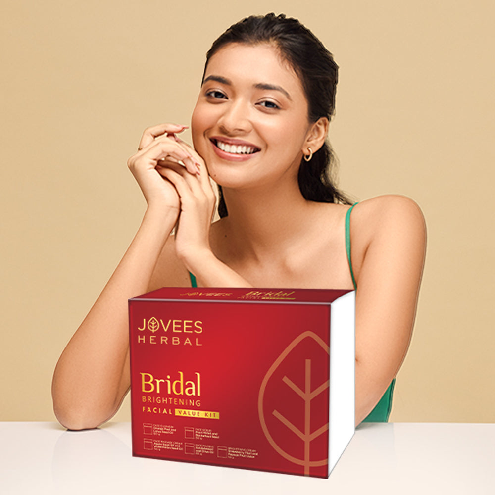 Woman with a Jovees Herbal Bridal Brightening Facial Balance Kit on a beige background